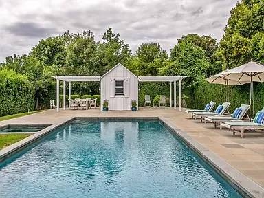 56 Butter Lane Bridgehampton, NY 11932 - Photo 4 of 18 a view of a house with pool and chairs