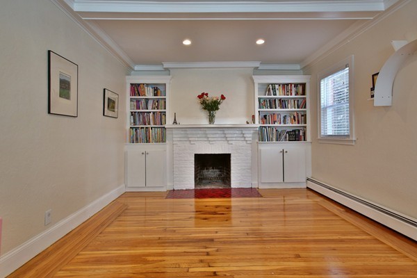 336 Russett Road Brookline, MA 02467 - Photo 3 of 16 a view of a livingroom with a fireplace window and wooden floor