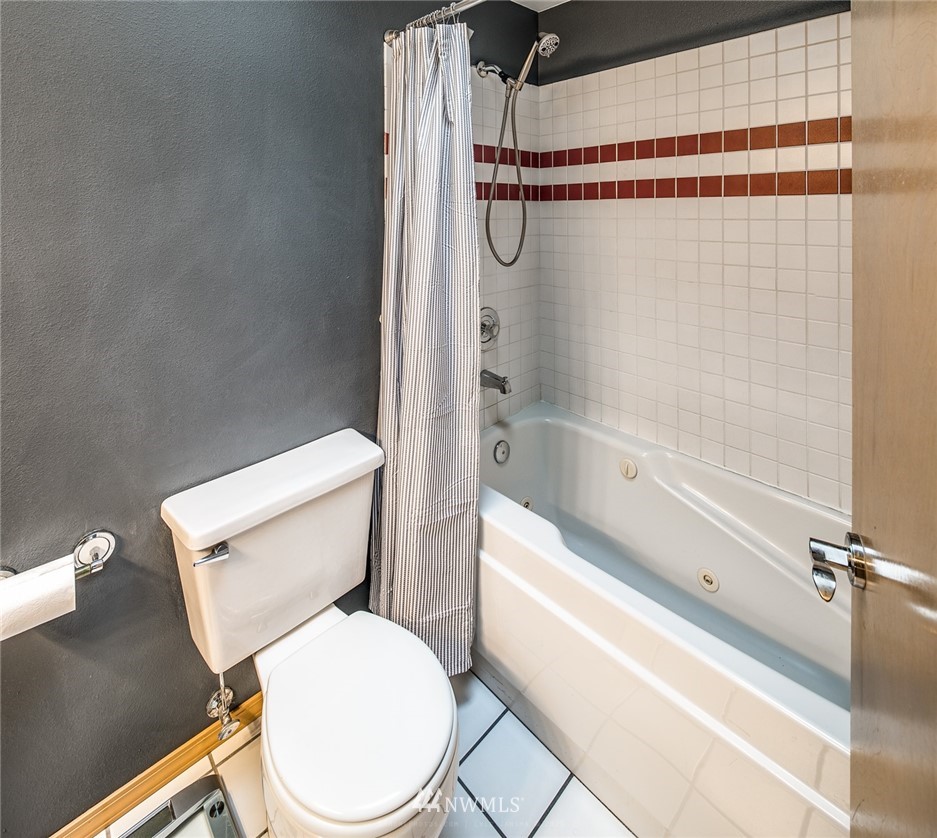 3838 Spring Coulee Road Bellingham, WA 98226 - Photo 22 of 34 a white toilet sitting next to a bath tub and shower