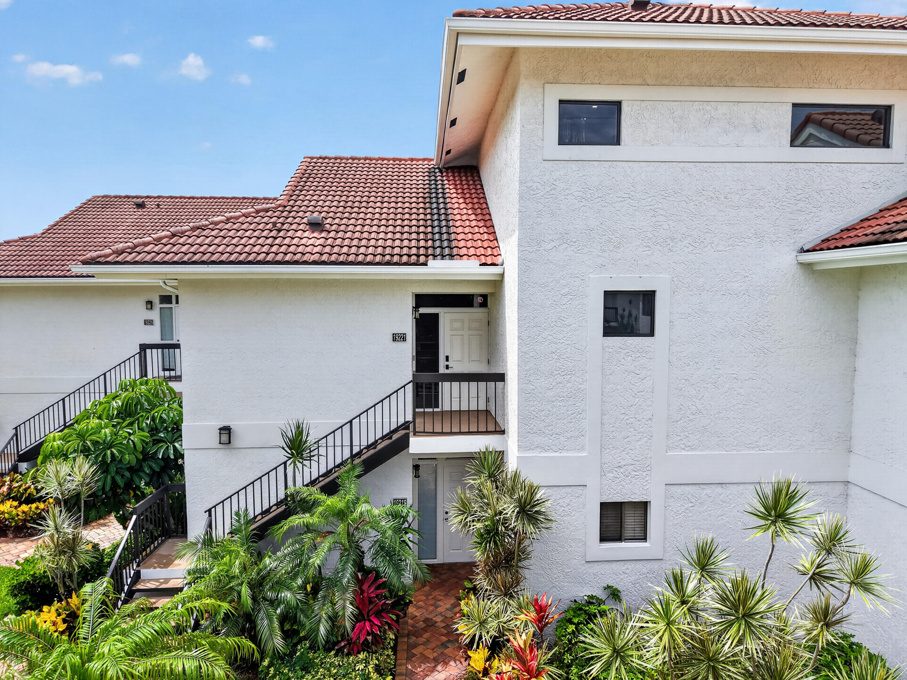 19221 Sabal Lake Drive, Unit 5124 Boca Raton, FL 33434 - Photo 46 of 98 a house with a flower garden