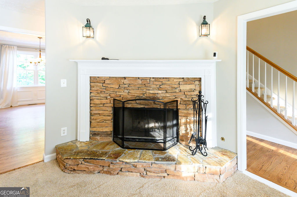 3301 Connie Way Winston, GA 30187 - Photo 11 of 40 a living room with furniture a fireplace and a table