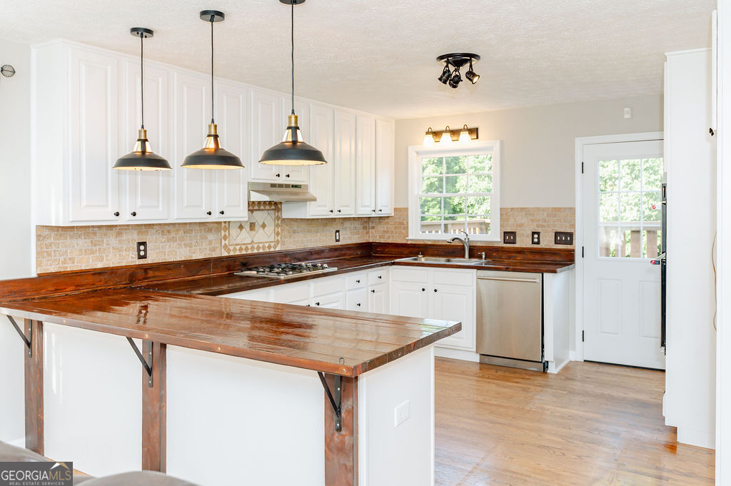 3301 Connie Way Winston, GA 30187 - Photo 13 of 40 a kitchen with a sink a counter top space and a window