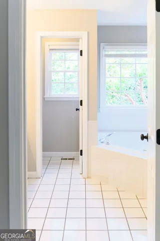a bathroom with a glass shower door