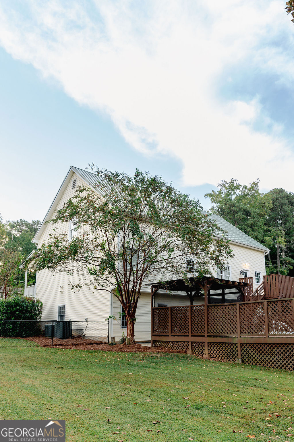 3301 Connie Way Winston, GA 30187 - Photo 2 of 40 a view of a house with a big yard and large trees