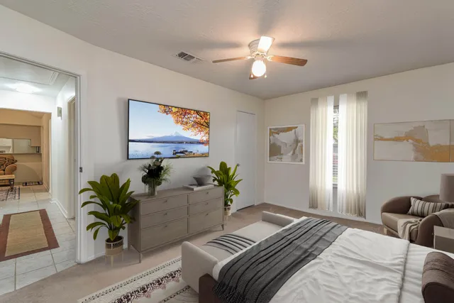 a bedroom with furniture and a chandelier