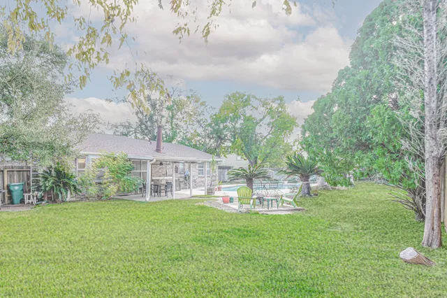 a view of a house with a yard porch and sitting area