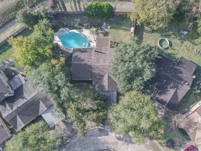 an aerial view of a house with outdoor space
