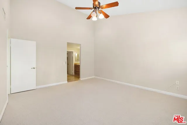 a spacious bathroom with a granite countertop sink mirror and double