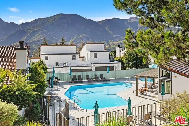 a house view with a backyard space