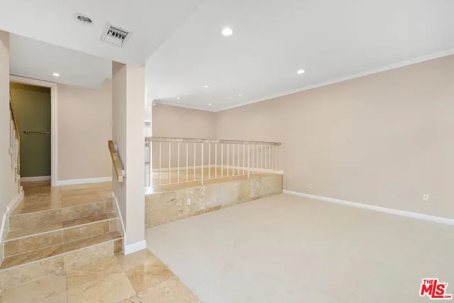 a view of empty room with a fireplace