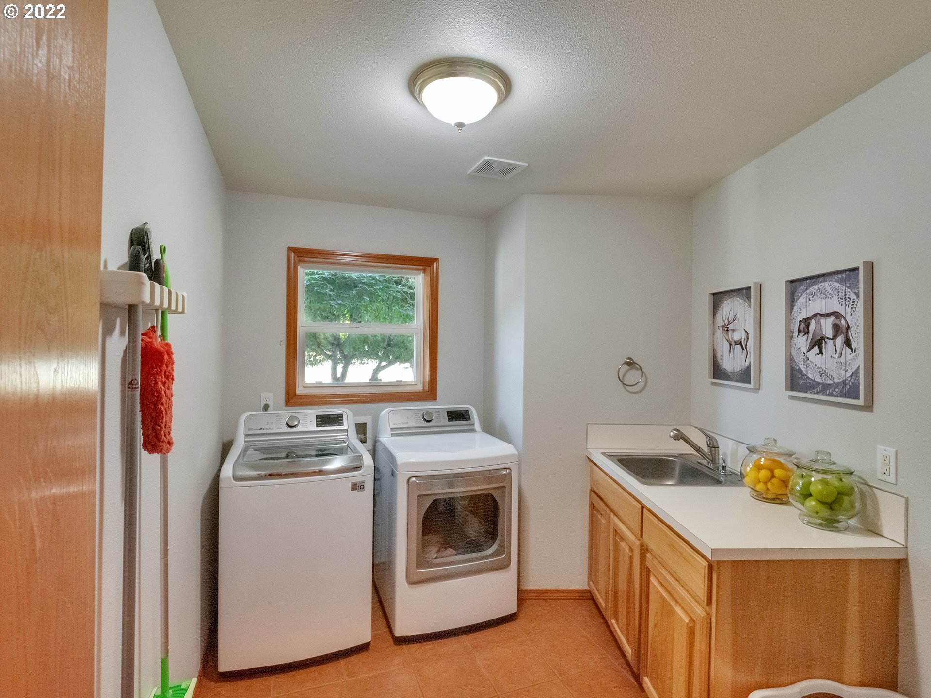 3000 Northwest 299th Street Ridgefield, WA 98642 - Photo 11 of 35 a utility room with dryer washer and a window