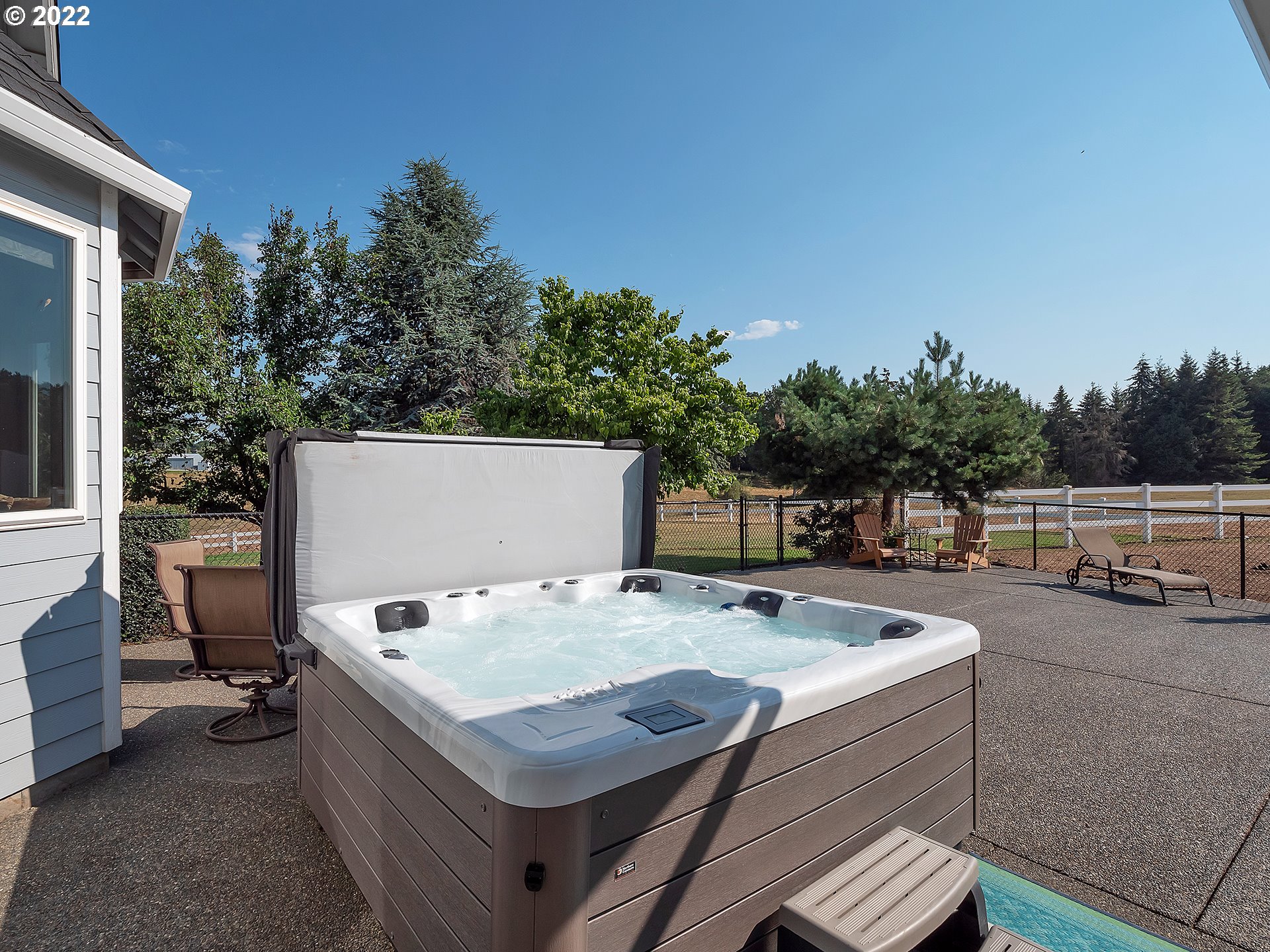 3000 Northwest 299th Street Ridgefield, WA 98642 - Photo 17 of 35 a terrace with outdoor seating and trees
