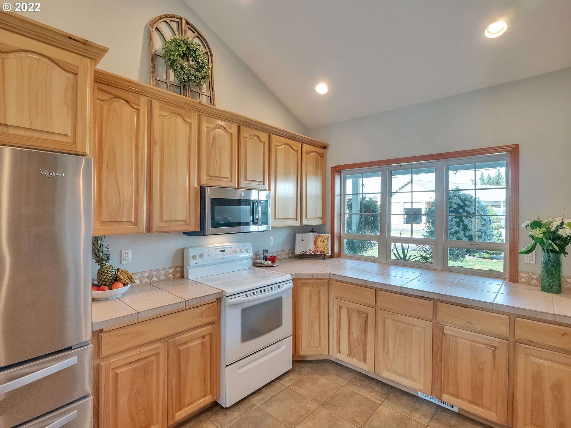 3000 Northwest 299th Street Ridgefield, WA 98642 - Photo 9 of 35 a kitchen that has a sink and a stove with white walls