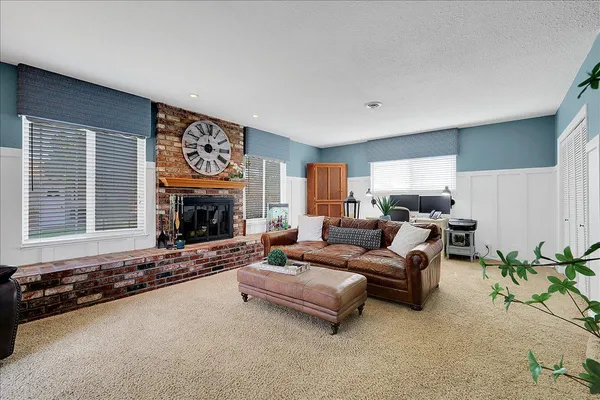 a bedroom with furniture and a flat screen tv