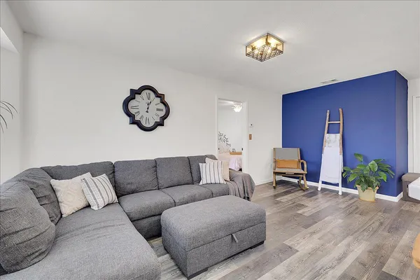 a living room with furniture and a window