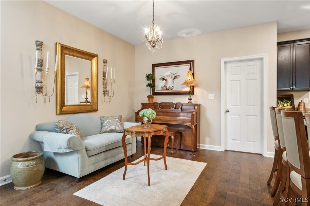 5587 Brixton Road Williamsburg, VA 23185 - Photo 19 of 42 a living room with furniture a desk and chair with wooden floor