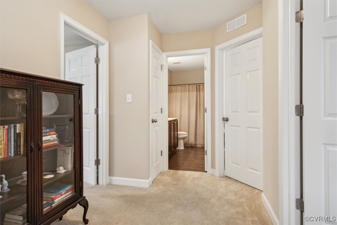 5587 Brixton Road Williamsburg, VA 23185 - Photo 23 of 42 a view of a bathroom with a glass door