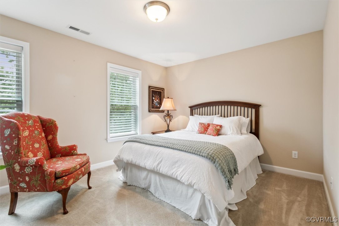 5587 Brixton Road Williamsburg, VA 23185 - Photo 25 of 42 a bedroom with a bed and a couch