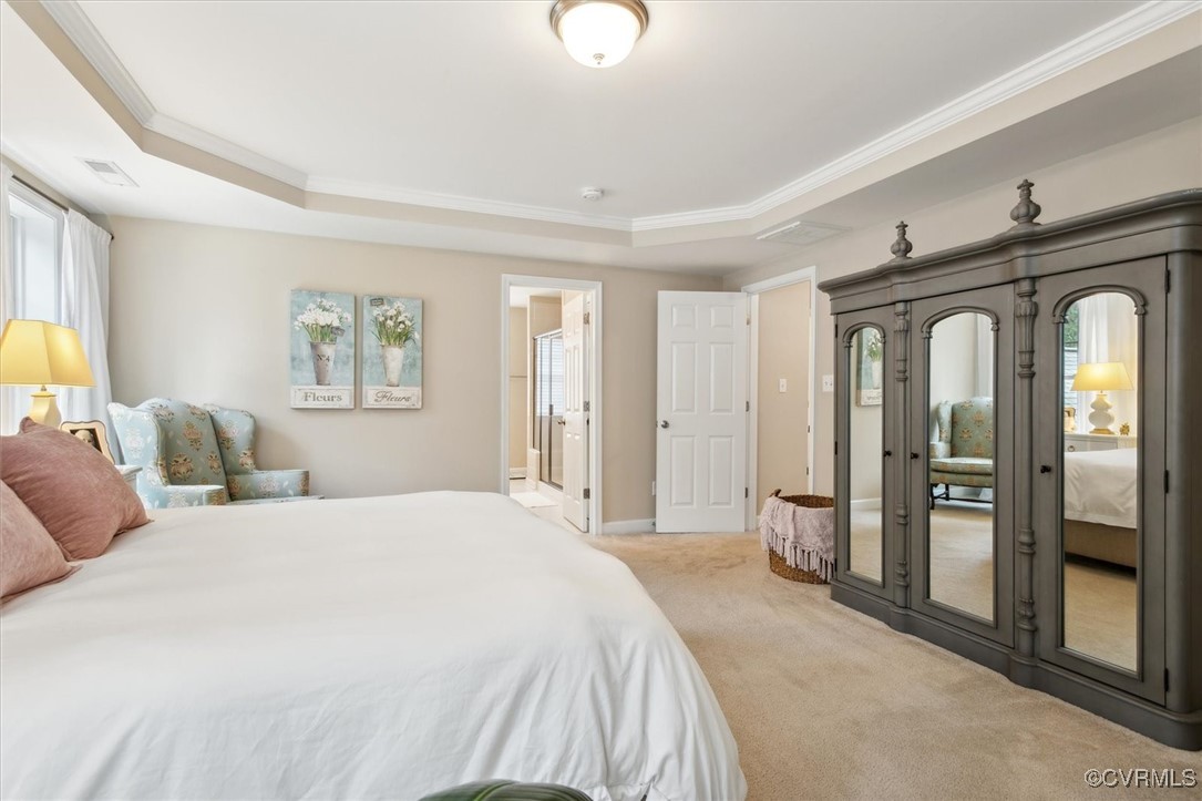 5587 Brixton Road Williamsburg, VA 23185 - Photo 30 of 42 a spacious bedroom with a bed and a dresser