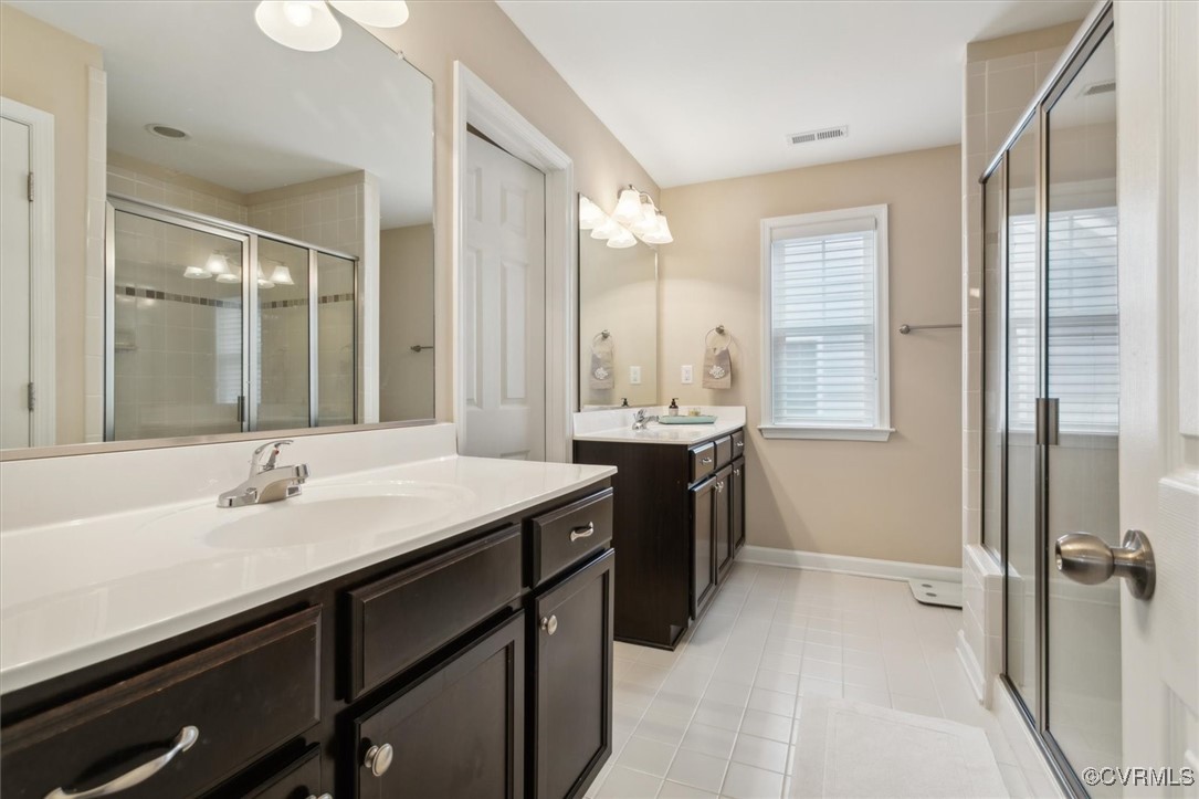 5587 Brixton Road Williamsburg, VA 23185 - Photo 31 of 42 a bathroom with a sink double vanity and a mirror