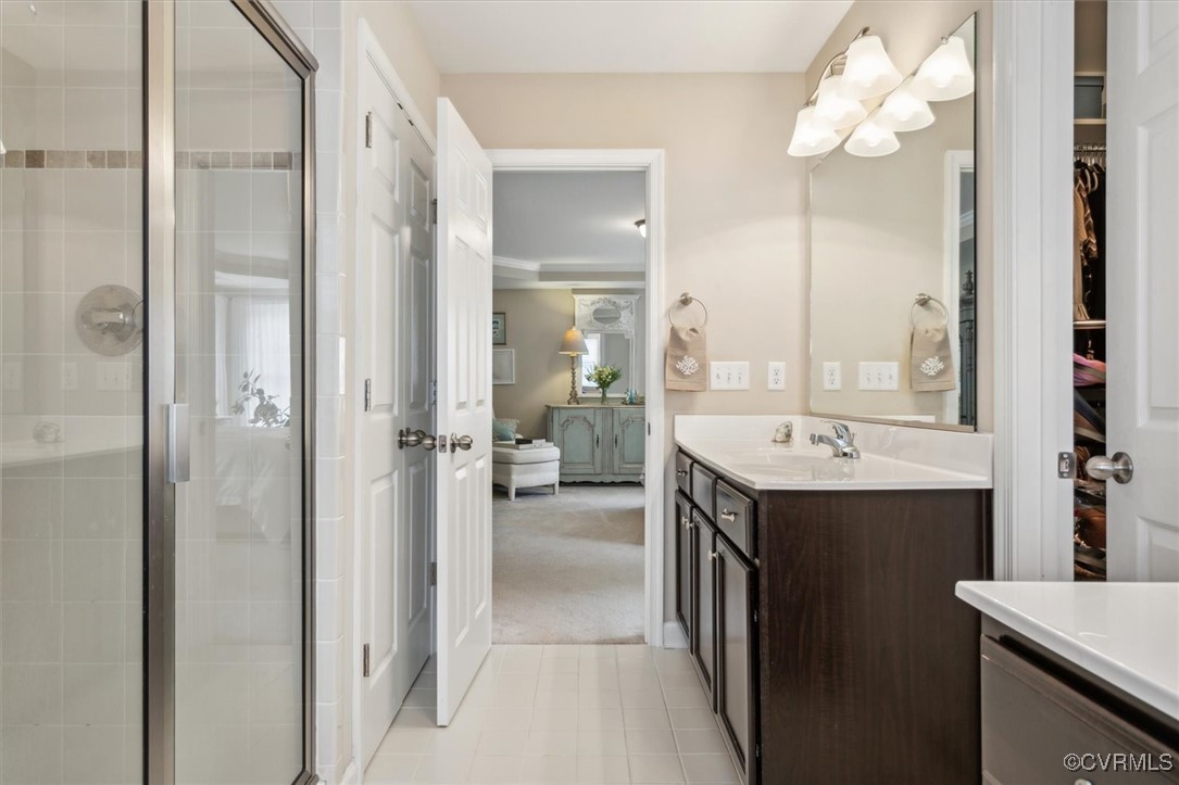 5587 Brixton Road Williamsburg, VA 23185 - Photo 32 of 42 a view of a bathroom with a sink and mirror