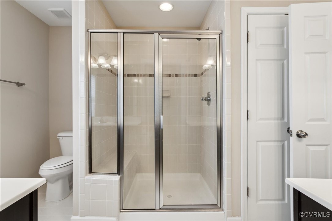 5587 Brixton Road Williamsburg, VA 23185 - Photo 33 of 42 a bathroom with a glass shower door