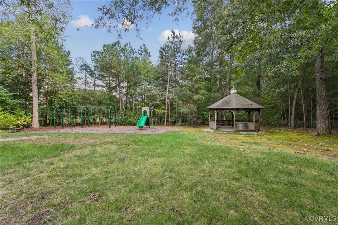 5587 Brixton Road Williamsburg, VA 23185 - Photo 38 of 42 a front view of a house with yard and trees