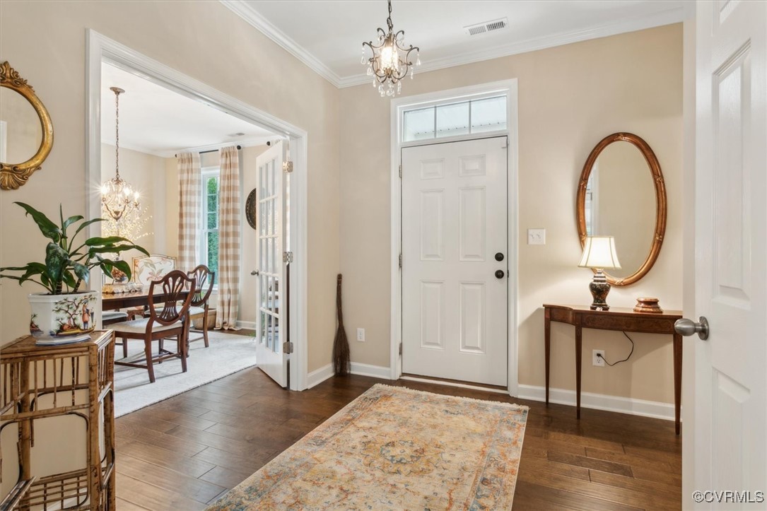 5587 Brixton Road Williamsburg, VA 23185 - Photo 5 of 42 a view of living room filled with furniture and wooden floor