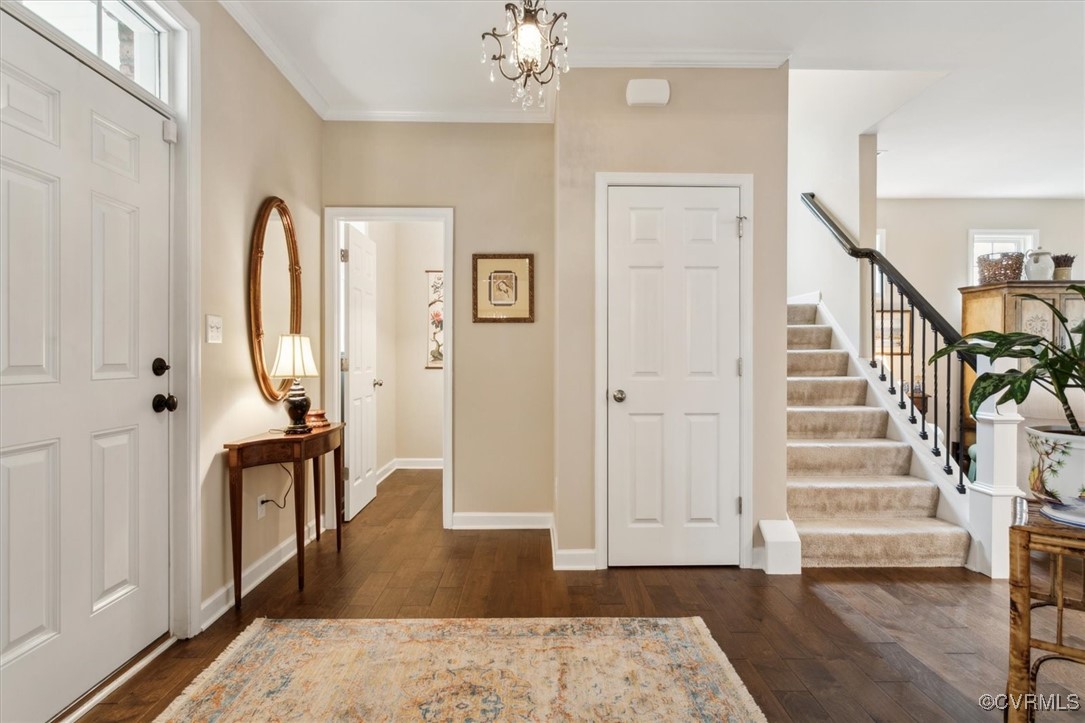 5587 Brixton Road Williamsburg, VA 23185 - Photo 6 of 42 a view of an entryway with wooden floor and mirror