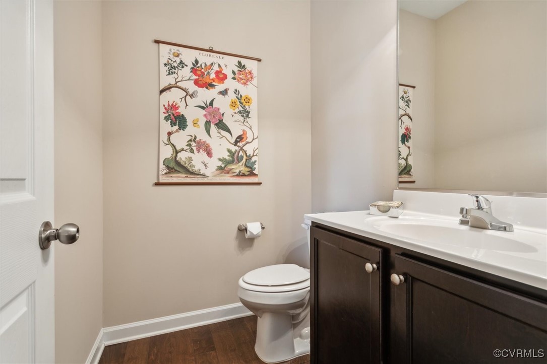 5587 Brixton Road Williamsburg, VA 23185 - Photo 9 of 42 a bathroom with a toilet a sink and mirror