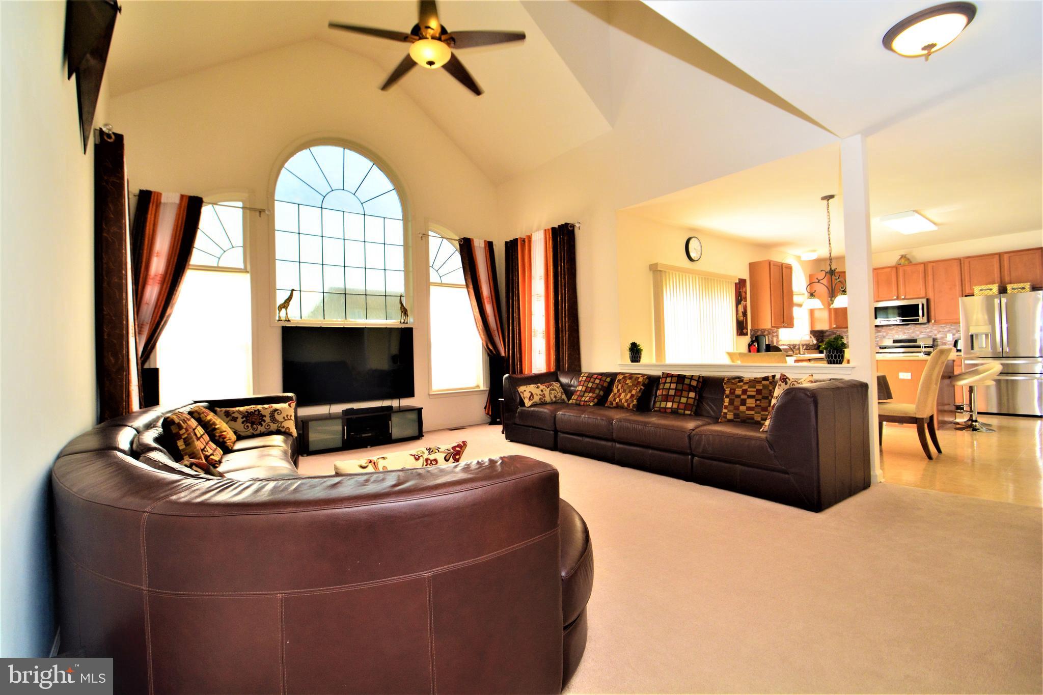 176 Gravelly Run Branch Road Clayton, DE 19938 - Photo 16 of 52 a living room with furniture and a flat screen tv