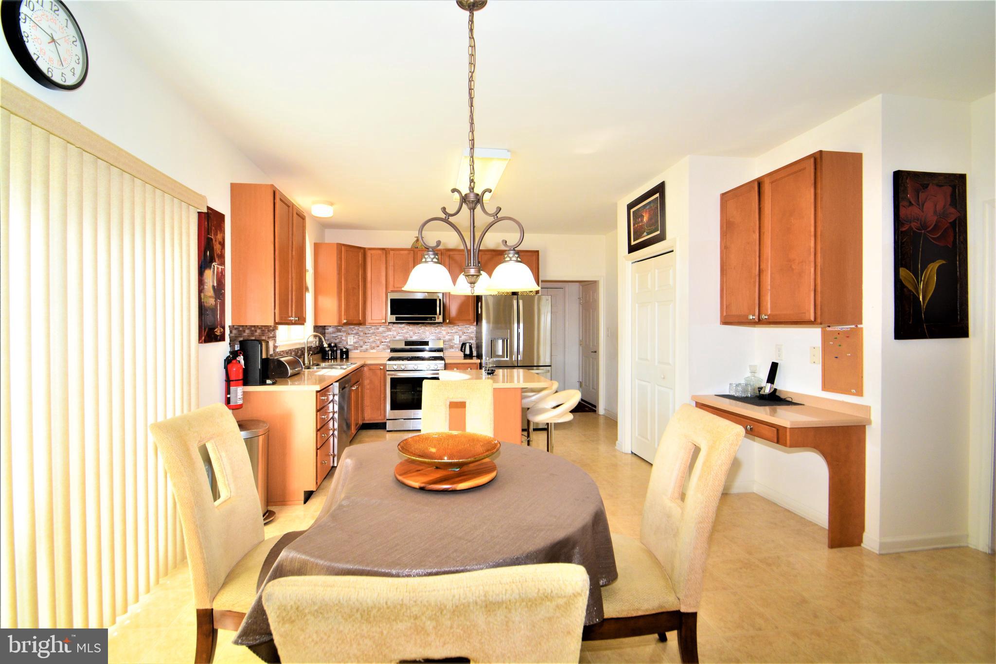 176 Gravelly Run Branch Road Clayton, DE 19938 - Photo 21 of 52 a dining room filled with furniture and a chandelier