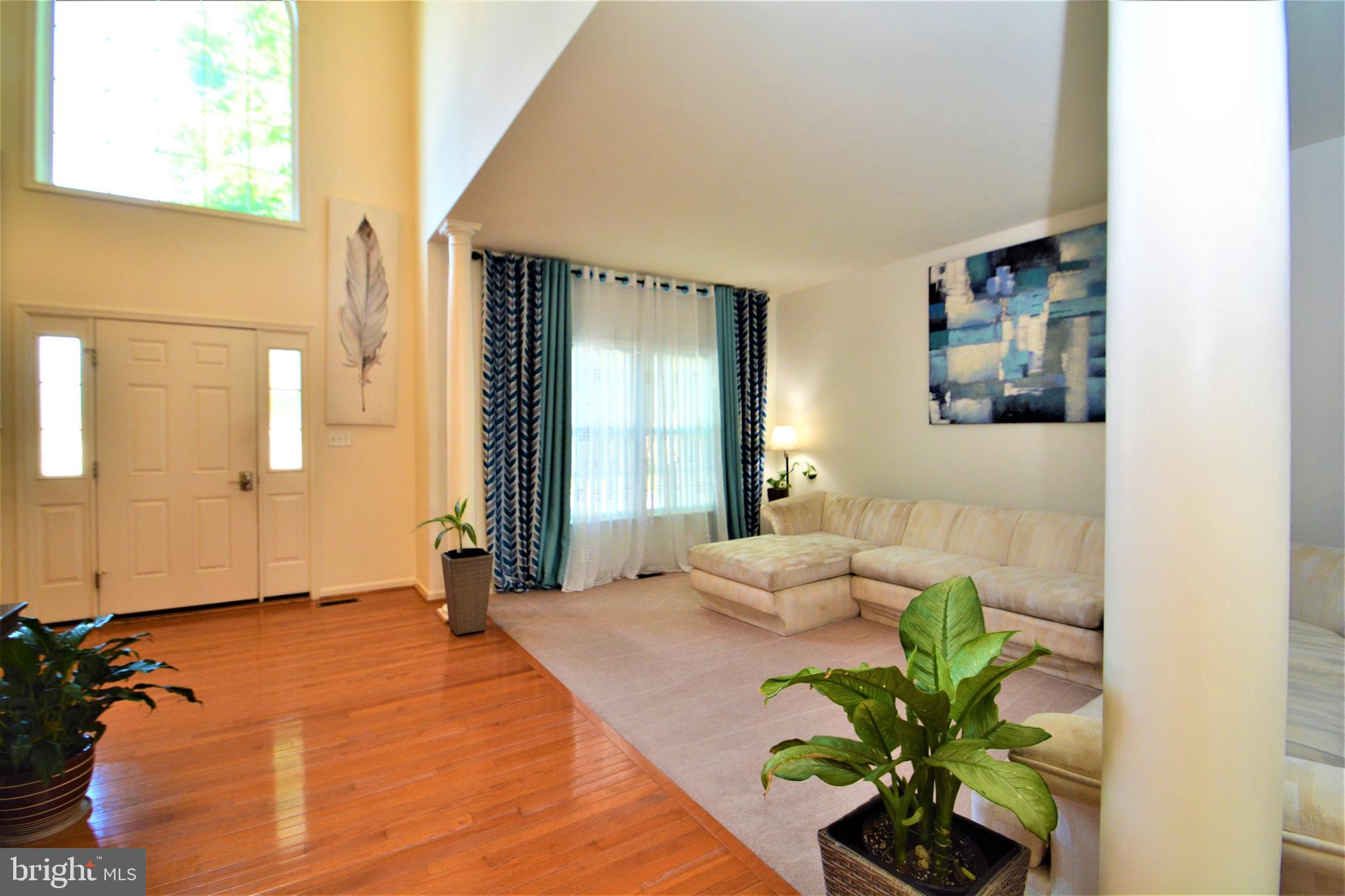 176 Gravelly Run Branch Road Clayton, DE 19938 - Photo 27 of 52 a bedroom with a bed and a painting on the wall
