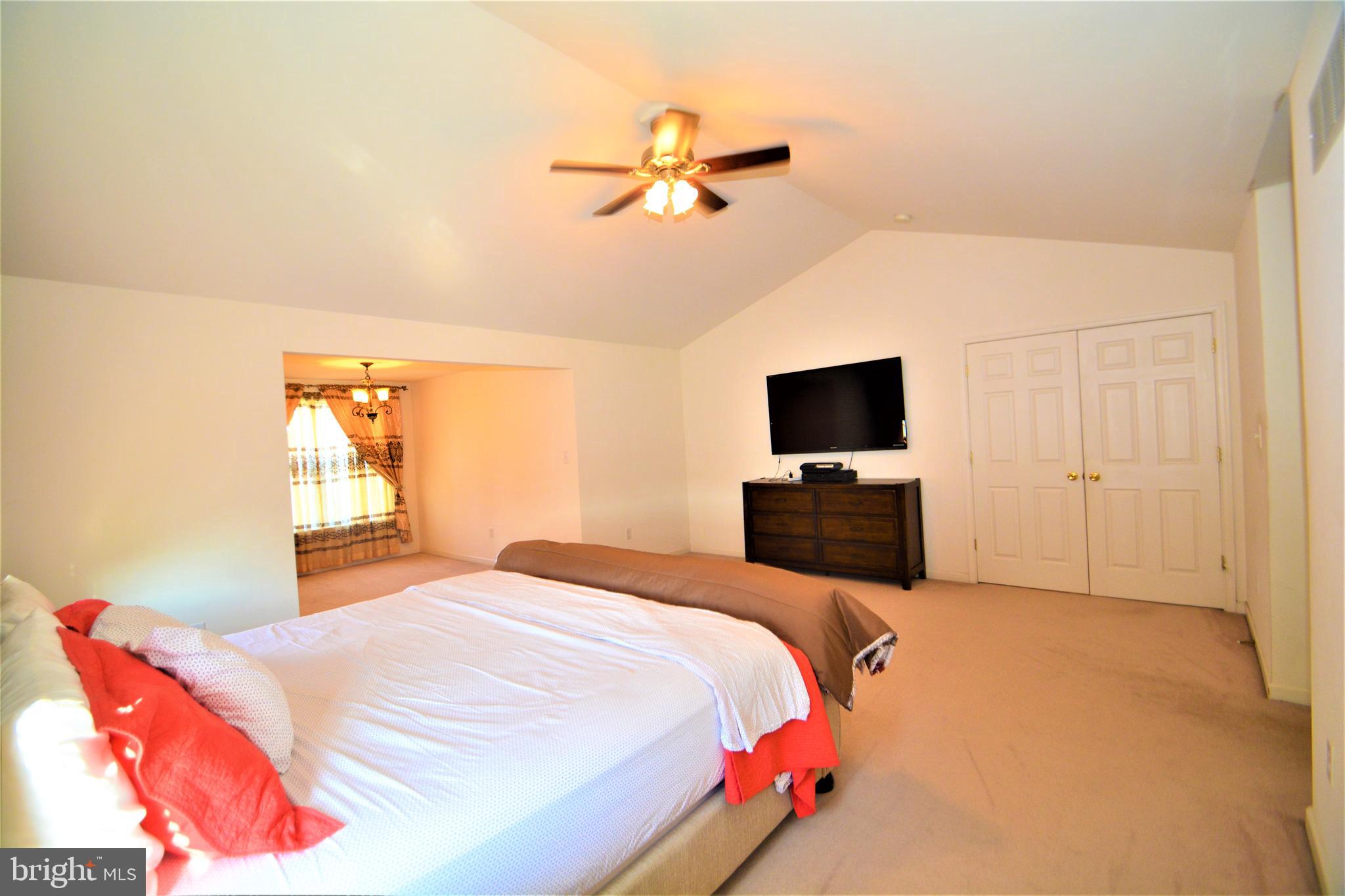 176 Gravelly Run Branch Road Clayton, DE 19938 - Photo 33 of 52 a bedroom with a bed and a tv