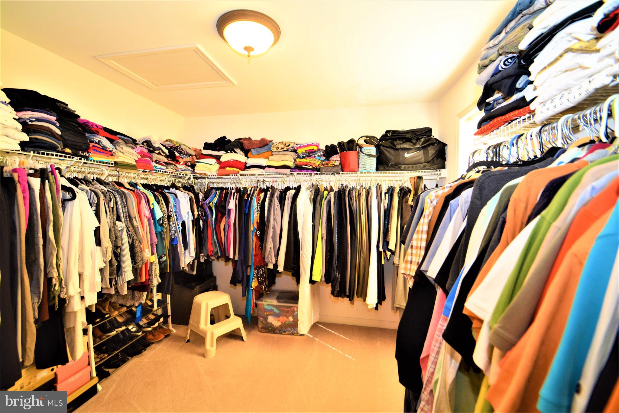 176 Gravelly Run Branch Road Clayton, DE 19938 - Photo 36 of 52 a view of walk in closet with clothes and shoes