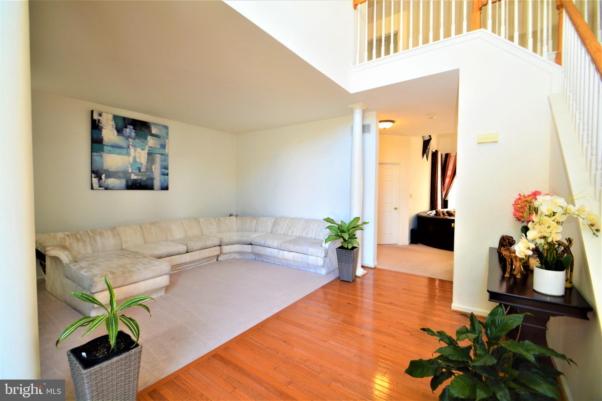 176 Gravelly Run Branch Road Clayton, DE 19938 - Photo 6 of 52 a living room with furniture and flowers