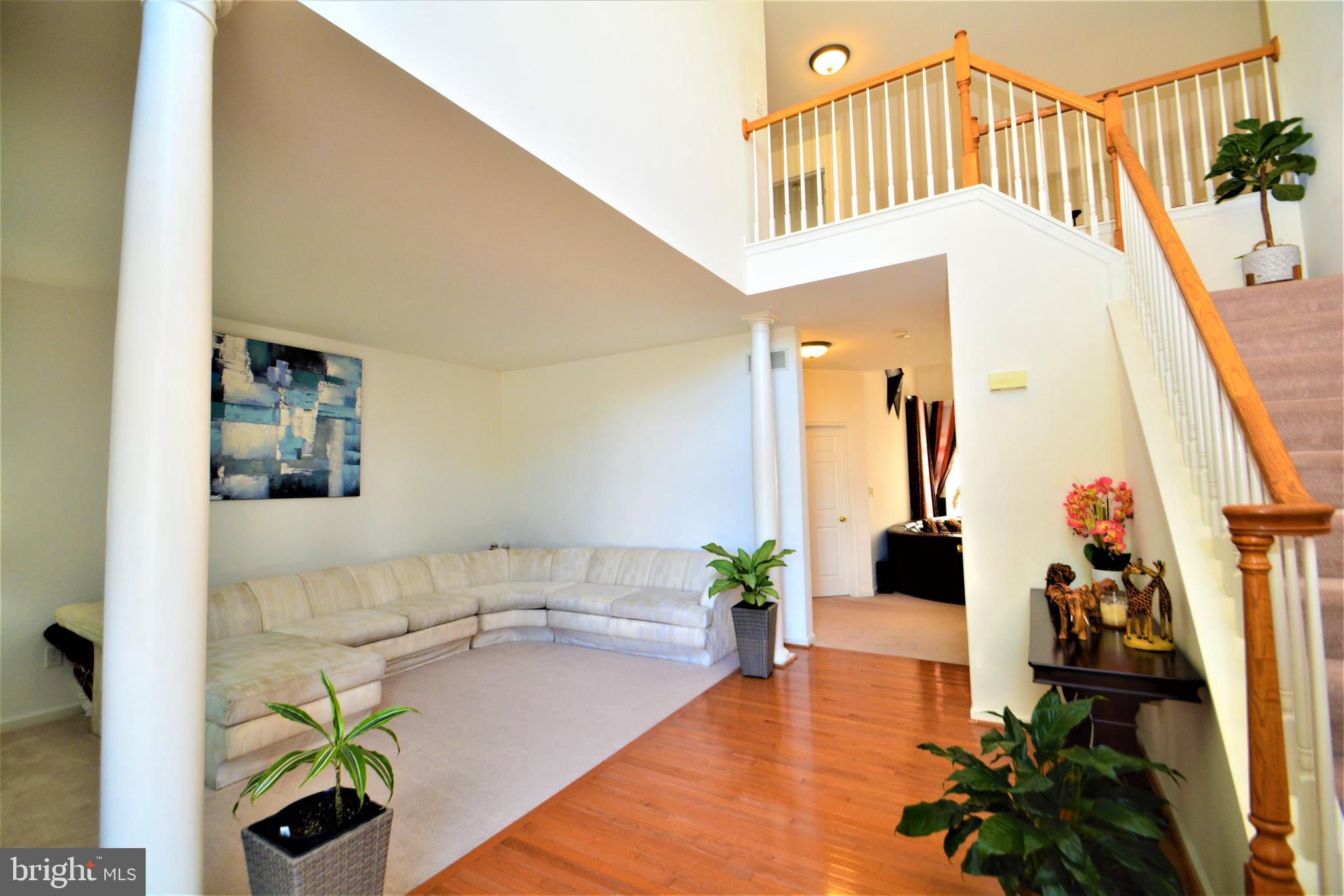 176 Gravelly Run Branch Road Clayton, DE 19938 - Photo 7 of 52 a living room with furniture and a potted plant