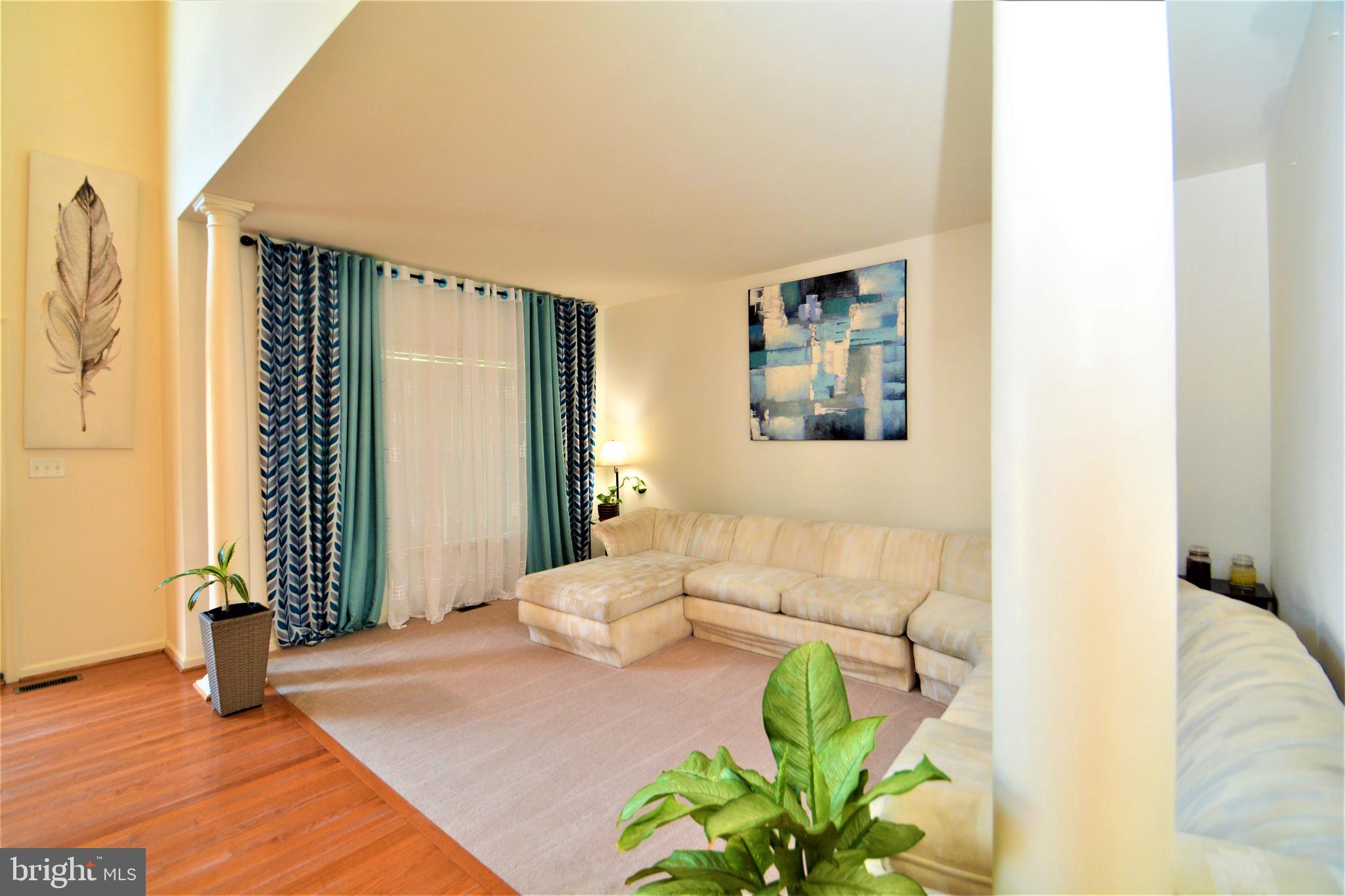 176 Gravelly Run Branch Road Clayton, DE 19938 - Photo 8 of 52 a living room with furniture and a potted plant