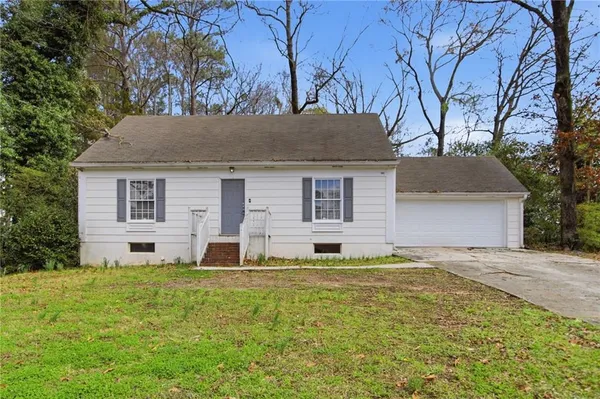 front view of a house with a yard