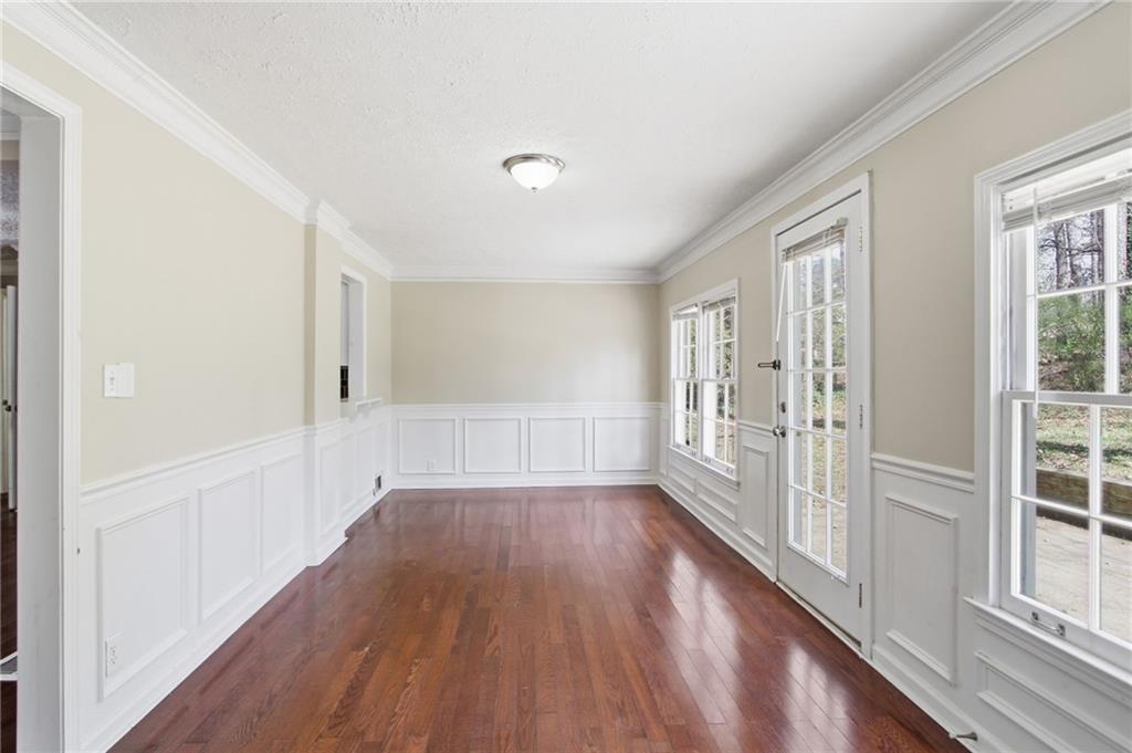2366 Flint Rock Road Southwest Stone Mountain, GA 30087 - Photo 18 of 40 a view of a room with wooden floor and windows