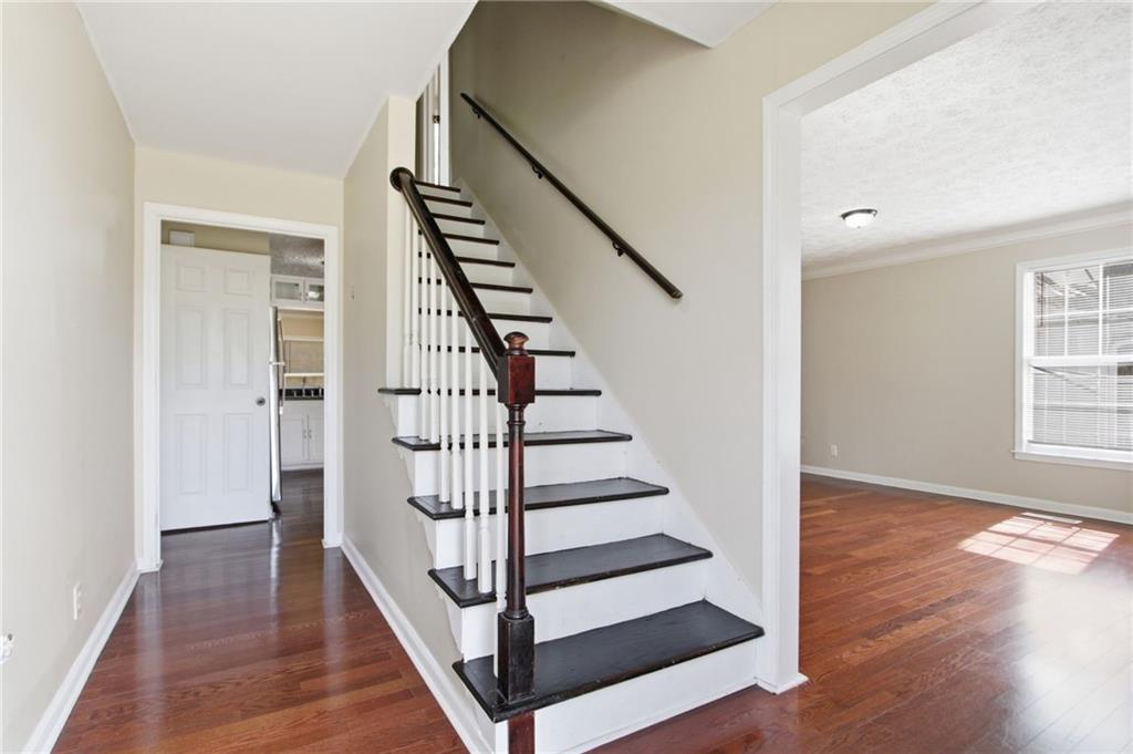 2366 Flint Rock Road Southwest Stone Mountain, GA 30087 - Photo 20 of 40 a view of entryway with wooden floor and stairs