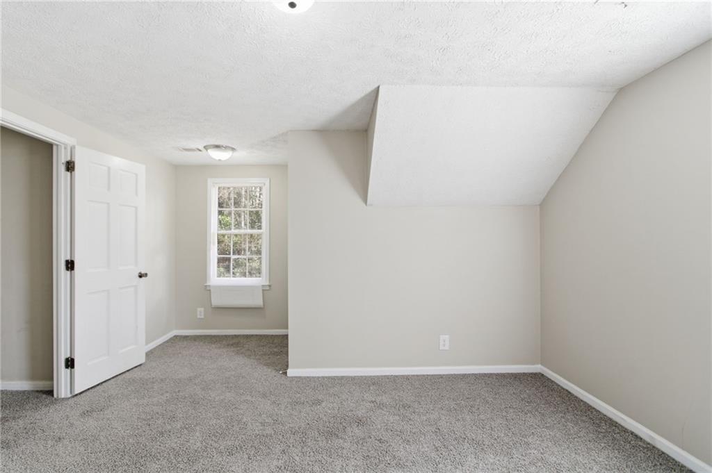2366 Flint Rock Road Southwest Stone Mountain, GA 30087 - Photo 23 of 40 a view of an empty room with a window