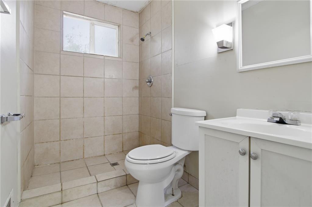 2366 Flint Rock Road Southwest Stone Mountain, GA 30087 - Photo 26 of 40 a bathroom with a sink toilet and shower