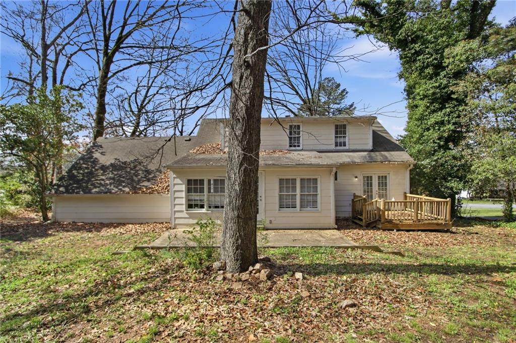 2366 Flint Rock Road Southwest Stone Mountain, GA 30087 - Photo 34 of 40 a view of a house with a yard