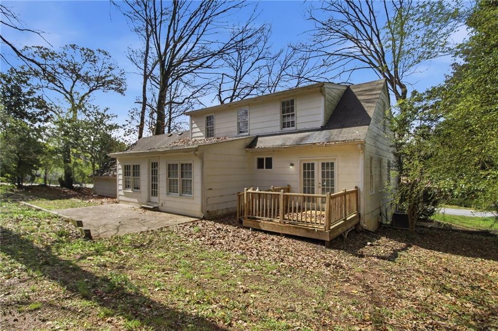 2366 Flint Rock Road Southwest Stone Mountain, GA 30087 - Photo 35 of 40 a front view of a house with a yard