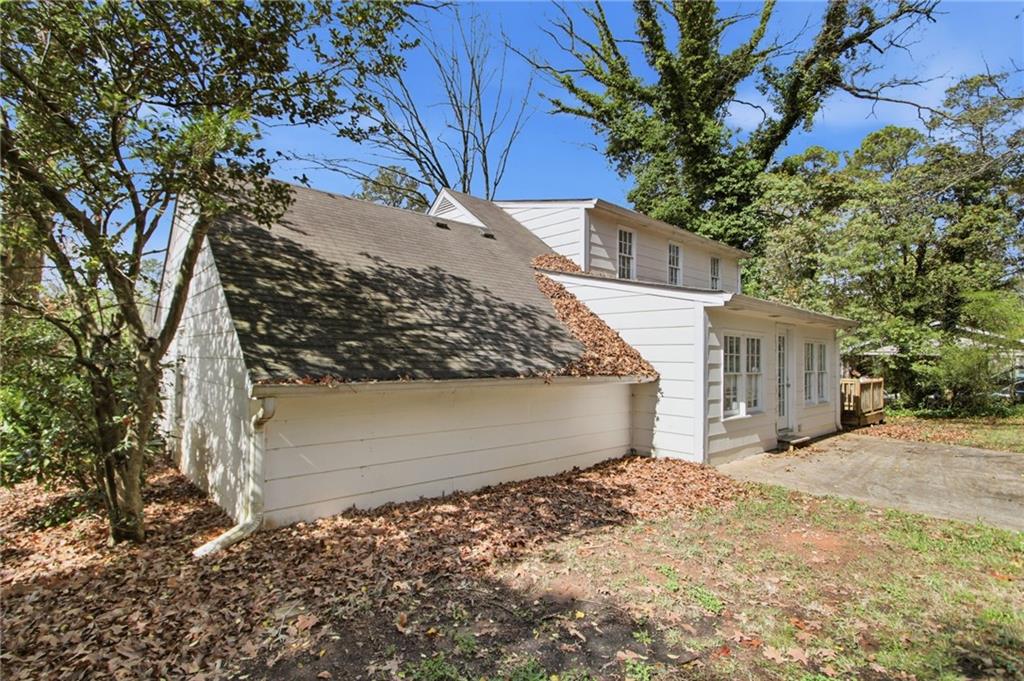2366 Flint Rock Road Southwest Stone Mountain, GA 30087 - Photo 36 of 40 a view of a house with a yard