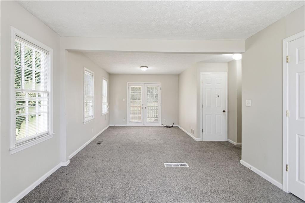 2366 Flint Rock Road Southwest Stone Mountain, GA 30087 - Photo 10 of 40 a view of an empty room with a window