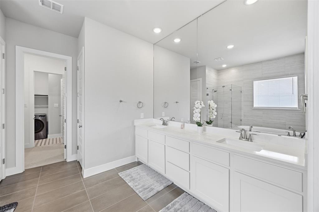 5805 Heatherwood Loop Sachse, TX 75048 - Photo 24 of 39 a bathroom with a double vanity sink mirror and