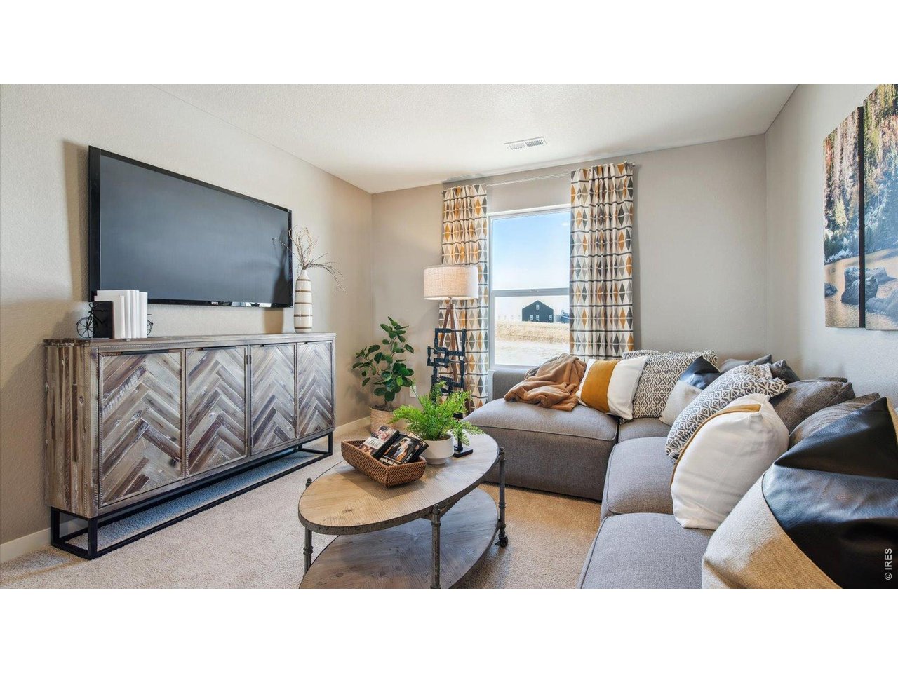 2338 Base Street Fort Lupton, CO 80621 - Photo 13 of 24 a living room with furniture and a flat screen tv