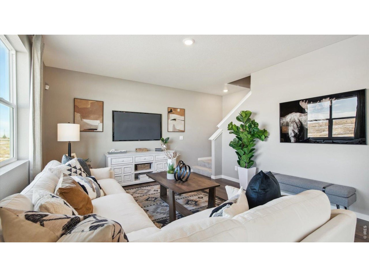 2338 Base Street Fort Lupton, CO 80621 - Photo 23 of 24 a living room with furniture and a flat screen tv